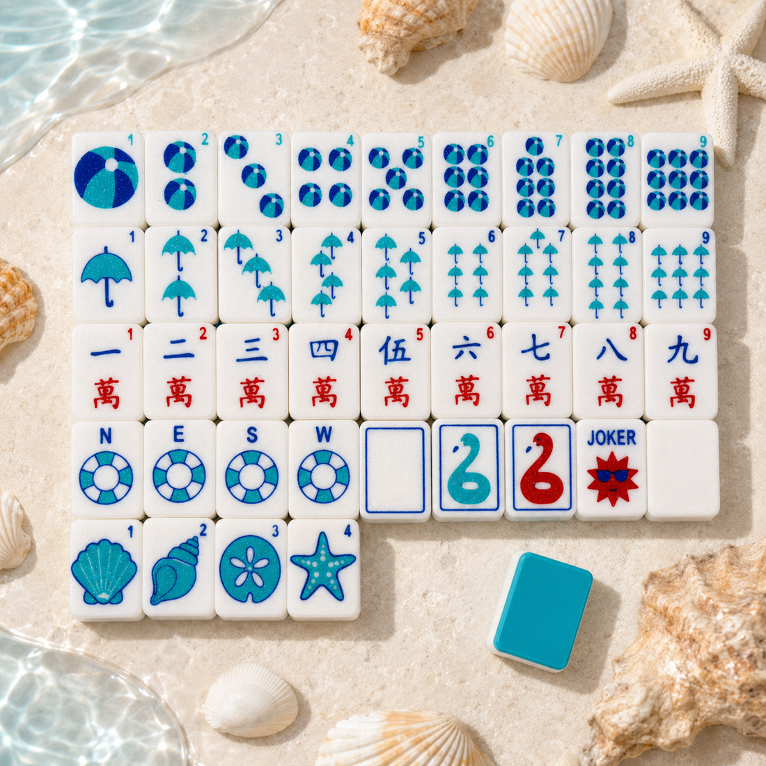 Full size Beach Set mahjong tiles arranged beside shells and water