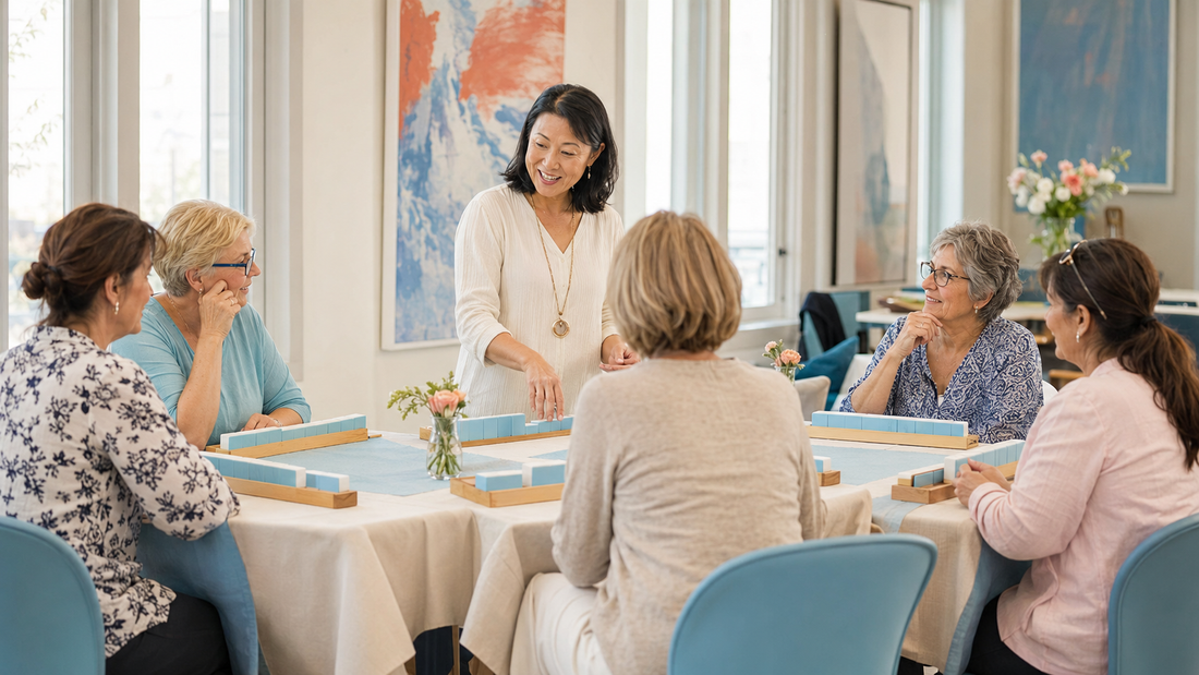 Women learning American mahjong together in a bright indoor workshop