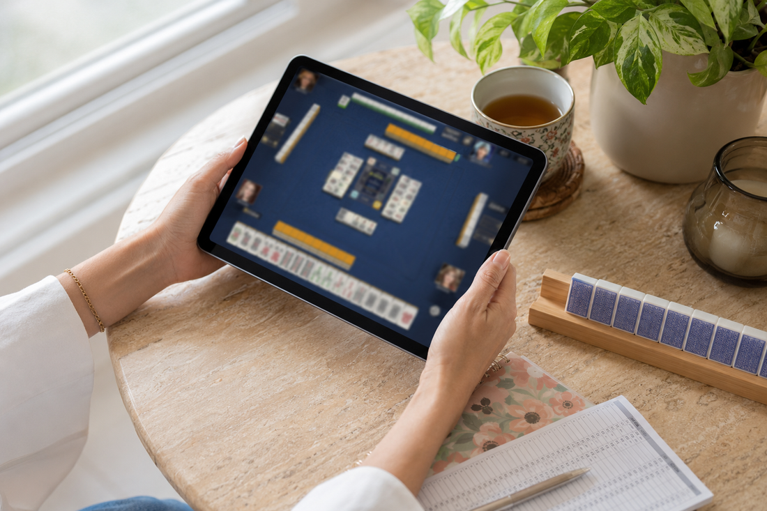 Woman using a tablet to play American mahjong online